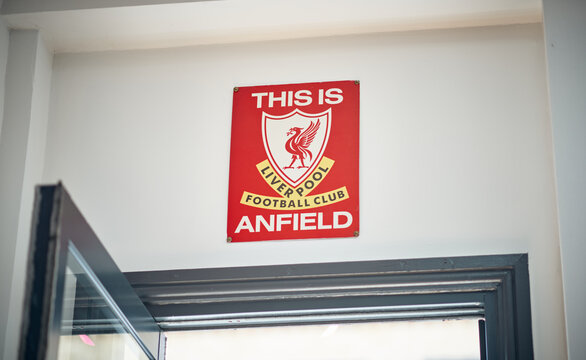 Kent, UK, 01.01.2026. Liverpool Football Club memorabilia including a red Anfield sign, flag and framed wall clock, featuring the iconic crest and bold red colour, representing football culture.