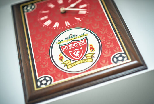 Kent, UK, 01.01.2026. Liverpool Football Club memorabilia including a red Anfield sign, flag and framed wall clock, featuring the iconic crest and bold red colour, representing football culture.