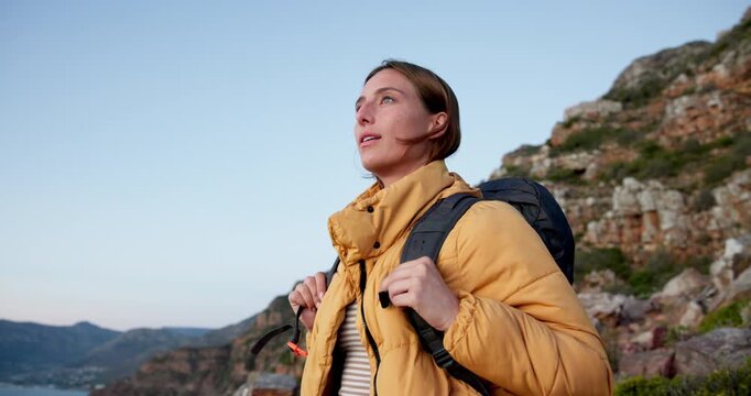 Smile, woman and hiking with breathing on mountain for travel, adventure and fresh air. Space, female person and inhale with reflection, backpacking view and trekking fitness for sightseeing nature
