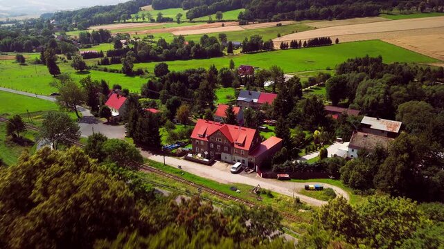 Aerial Drone View of Rural Village in Lower Silesia in the morning, Rolling Hills and Late Summer Landscape