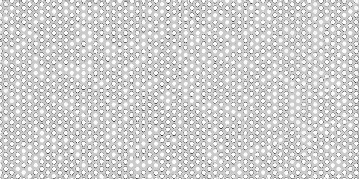 Close up of a perforated metal sheet with a repeating hole pattern