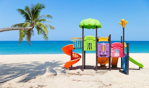 Colourful kids play ground on tropical beach, summer outdoor activity, playful and fun time