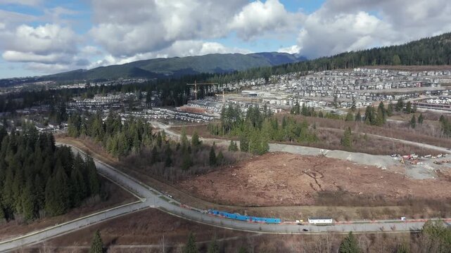Residential Neighbourhood With Townhouses Along Pitt River Road In Port Coquitlam, British Columbia, Canada. Aerial Drone Shot