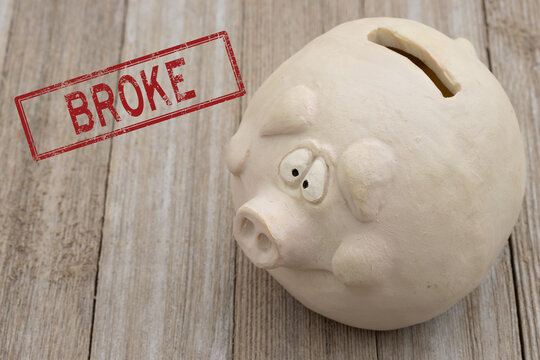 Worried piggy bank with broke financial