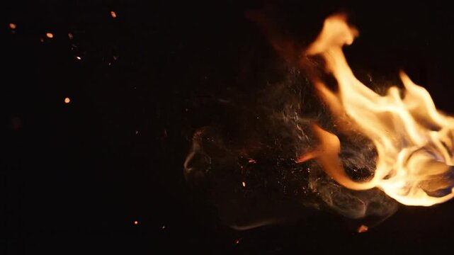 Fiery Dance: Capturing the captivating dance of flames against a dark backdrop, showcasing the raw power and mesmerizing beauty of fire.