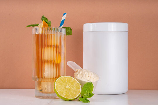 Protein Iced Tea, cold summer drink rich in protein, made with clear whey isolate powder, lemon lime juice, mint and ice cubes, copy space