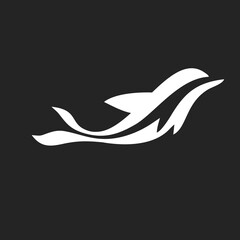 Obraz premium Abstract White Dolphin Logo Design Swimming Silhouette Isolated on Dark Background