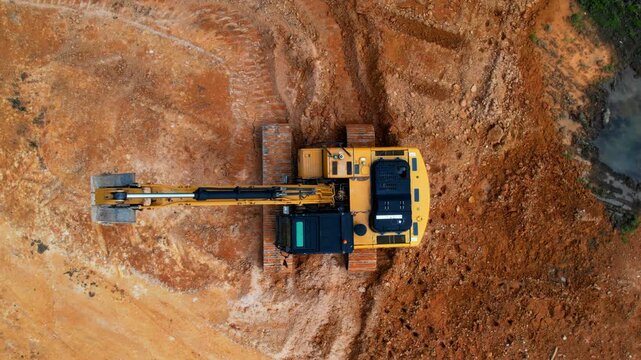 Overhead view of excavator in construction site.