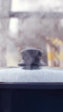 Steam from a cooking pot outdoors in slow motion
