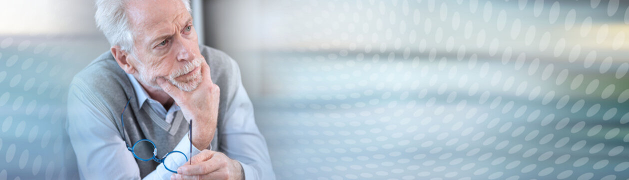 Pensive senior businessman; panoramic banner