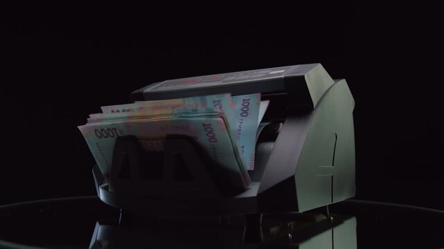 Automatic cash counting machine with Hryvnia banknotes