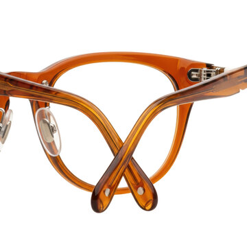 high-key macro image of modern panto eyeglasses frames made of translucent amber acetate with silver hinges, isolated on a brilliant white background, concept of luxury product precision