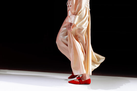 Elegant creative women fashion cloth, long yellow dress and velvet red shoes, chic clothes design outfit, Fashion model walking the runway fashion show