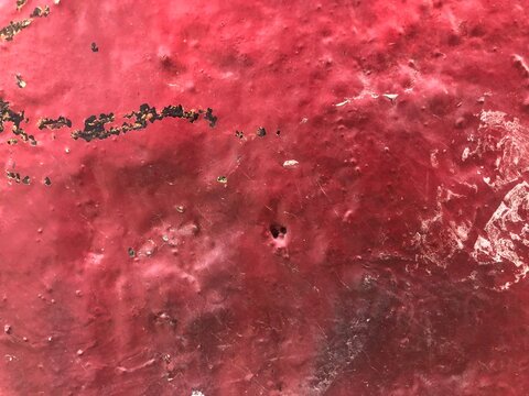 Detailed texture graffiti street-art red spray paint peeling  rough concrete wall