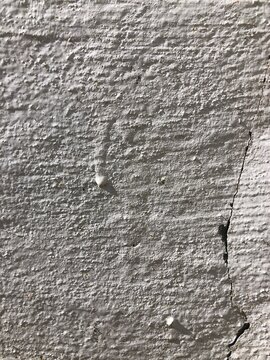 Gray cracked concrete old cement stone wall texture wallpaper background