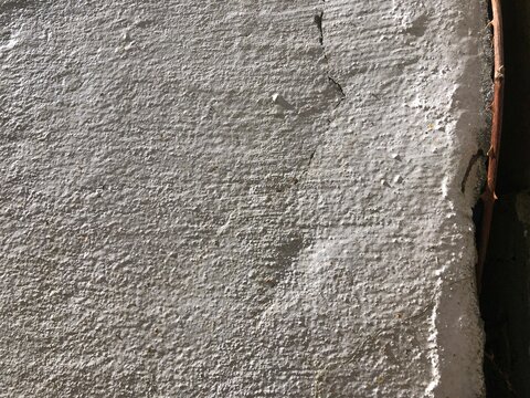 Gray cracked concrete old cement stone wall texture wallpaper background