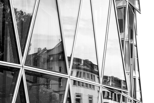 Frankfurt modern office architecture highlights a glass facade with reflection and pattern in an urban setting captured as elegant monochrome design