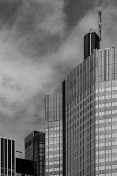 Frankfurt tower rises as a modern office skyscraper of glass where architecture meets sky in an urban scene finished in clean monochrome contrast