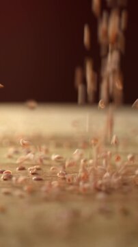 Psyllium seeds falling onto a wooden board