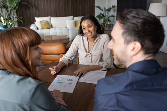 Financial advisor meeting with a couple to plan for their future 