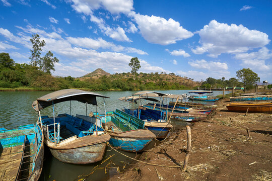 Traditional blue passenger boats moored on the Blue Nile river bank in Ethiopia