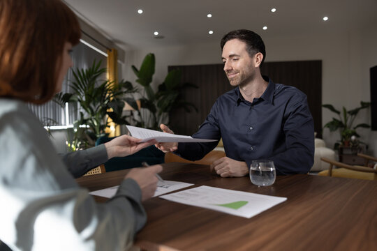 Financial advisor showing client investment strategies