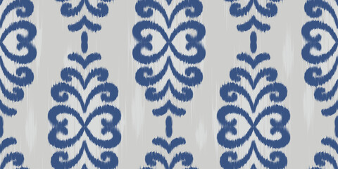 Ikat ethnic seamless pattern with blue floral abstract design. Rug textured vector print of embroidery art for traditional retro motif on textile and fabric. © Chorna_L