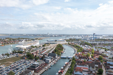 Obraz premium Aerial drone view over the yacht marina and boat harbor of Warnemünde with moored sailboats and motorboats, Rostock, Germany