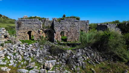 Fototapeta premium Aerial Panoramic View of the Column-Lined Street and Ancient Roman Ruins in Perge, Antalya, Turkey