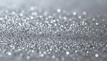 Obraz premium Silver sparkles create an enchanting shimmering background perfect for adding glamour to designs