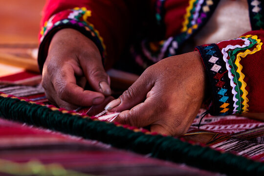 hands weaving incan cloth