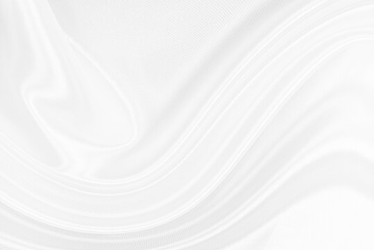 White gray satin texture that is white silver fabric silk background with beautiful soft blur pattern natural.