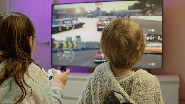 Heartwarming scene of young brother and sister laughing while playing video games on a console. They hold controllers with excitement, bright and cheerful atmosphere in a modern home 4K