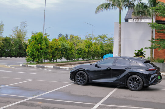 Batam, Indonesia  - march 15hth 2026 : The car in the image is a black Toyota Crown Sport crossover, distinguished by its sleek, aerodynamic profile and striking C-shaped LED signature lights.