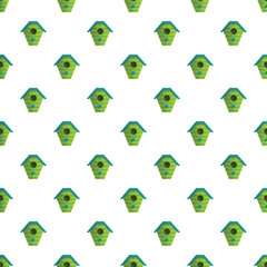 Naklejka premium Repetitive green birdhouses creating a seamless pattern on a clean white background