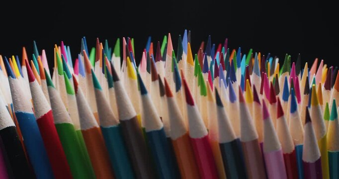 close-up of freshly sharpened colorful pencils. Bright tips and natural wooden bodies arranged together, ideal for school supplies, drawing and art projects concept 4K.