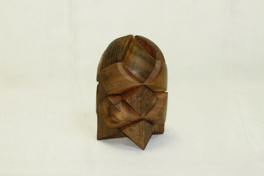 Handmade Wooden Burr Puzzle Brain Teaser Toy Isolated on White Background