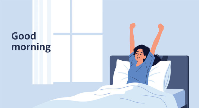 Happy young woman waking up and stretching her arms in bed with a good morning text and sunlight coming through the window.