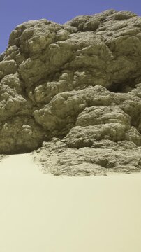 A stunning rocky outcrop rises amid golden sand dunes, illuminated by the sun. The texture of the rocks contrasts beautifully with the smooth, flowing curves of the surrounding sand.