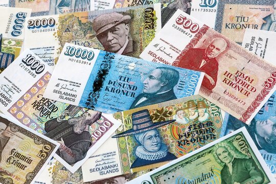 Icelandic krona money banknotes pile on table. Iceland bills of ISK currency. Concept of economy