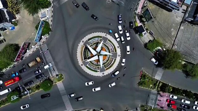 Aerial footage using a drone showing the roundabout at the 5-way intersection in Banda Aceh, Aceh, Indonesia. 