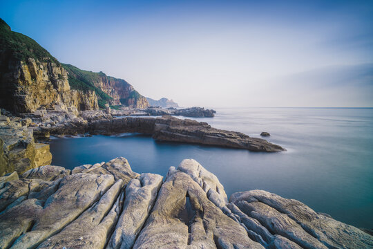 Longdong Bay Cape Coast Landscape - Northeast and Yilan Coast National Scenic Area. Long exposure at dawn, shot in Gongliao District, New Taipei, Taiwan.