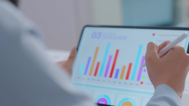 ฺBlur Close up. financial advisor or crypto trader holding digital tablet in hands consulting stock market investor analyzing trade charts dynamic indexes investing trends on tab screen. Business anal