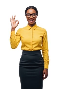 young african-american professional woman in a crisp yellow shirt, smiling enthusiastically, performing an a-ok sign against a transparent background, concept of corporate success