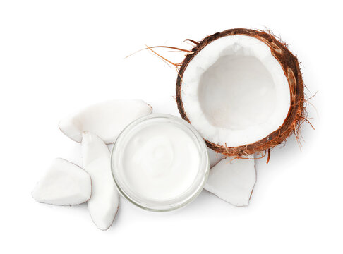 Delicious coconut yogurt in glass jar and pieces of fruit isolated on white, top view