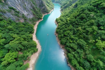 Obraz premium Breathtaking aerial view of serene river canyon in lush green landscape
