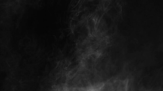 Abstract white smoke in slow motion. Smoke, Cloud of cold fog in light spot background. Light, white, fog, cloud, black background, 4k, ice smoke cloud. Floating fog.	