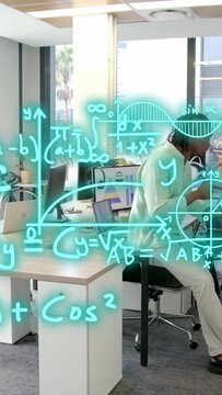 Seated man in green shirt, holding tablet, gesturing at shared desk, teal math overlays, copy space