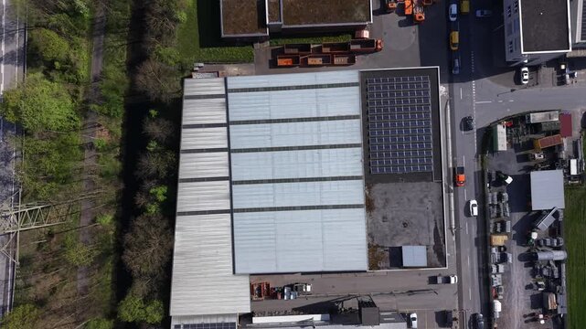 Drone footage flying above an electrical substation with transformers and power lines, showing energy infrastructure and distribution network.