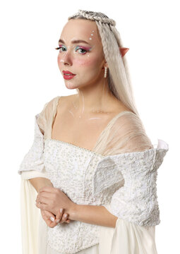 Beautiful girl dressed as elf on white background